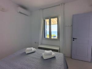 Postel nebo postele na pokoji v ubytování Stavros Bay