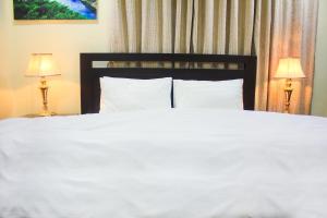 Ένα ή περισσότερα κρεβάτια σε δωμάτιο στο Starlit Hotel - Gilgit