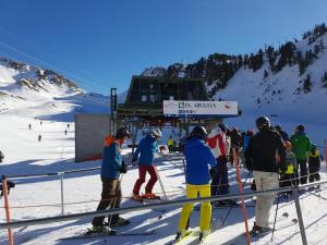 a group of people on skis at a ski lift at Can Vall Bellver in Bellver de Cerdanya 