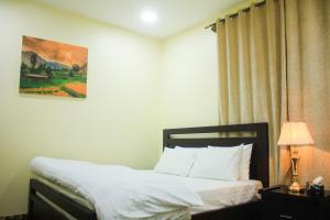 Ένα ή περισσότερα κρεβάτια σε δωμάτιο στο Starlit Hotel - Gilgit
