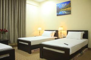 Ένα ή περισσότερα κρεβάτια σε δωμάτιο στο Starlit Hotel - Gilgit