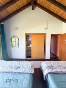 Postel nebo postele na pokoji v ubytování Essanya Chalet with a private pool - Country side of nabeul