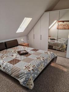 a bedroom with a large bed with glass walls at Ferienwohnung-mit-Balkon in Pinnow
