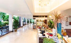 a lobby with a lot of plants on display at Loligo Resort Hua Hin in Hua Hin