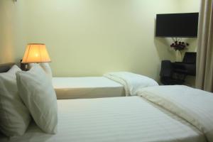 Ένα ή περισσότερα κρεβάτια σε δωμάτιο στο Starlit Hotel - Gilgit