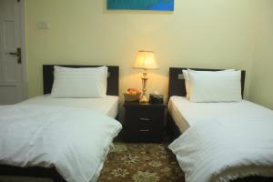 Ένα ή περισσότερα κρεβάτια σε δωμάτιο στο Starlit Hotel - Gilgit