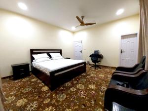 Ένα ή περισσότερα κρεβάτια σε δωμάτιο στο Starlit Hotel - Gilgit