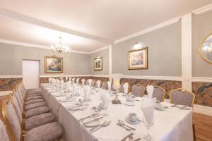 a large room with a long table and chairs at Castle Arch Hotel in Trim