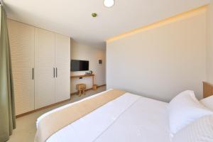 Postel nebo postele na pokoji v ubytování Lyxos Hotel