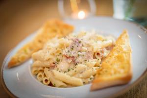 a white plate of pasta with at Castle Arch Hotel in Trim