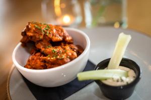 a bowl of food on a table with dipping sauce at Castle Arch Hotel in Trim