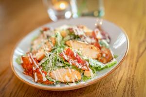 a plate of food with a salad on a table at Castle Arch Hotel in Trim
