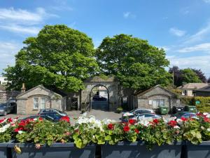 a window box with flowers in front of a house at Castle Arch Hotel in Trim