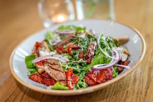 a salad with meat and vegetables in a bowl on a table at Castle Arch Hotel in Trim