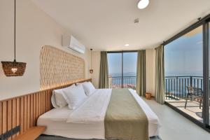 Postel nebo postele na pokoji v ubytování Lyxos Hotel