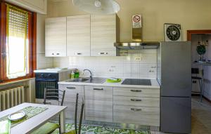 a kitchen with a sink and a table with chairs at Gorgeous Apartment In Cerreto Guidi in Cerreto Guidi