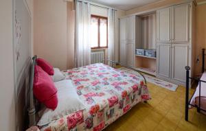 a bedroom with a bed and a window and a bed sidx sidx sidx at Gorgeous Apartment In Cerreto Guidi in Cerreto Guidi