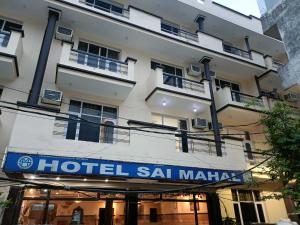 a hotel salmiya in front of a building at Collection O Shri Mata Vaishno Devi Railway Junction Formerly Sai Mahal in Katra