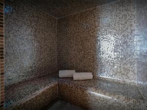 a corner of a room with a bathtub with a window at Chalet Le San Marco - OVO Network in La Clusaz