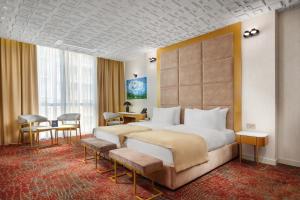 Voodi või voodid majutusasutuse Carat Hotel Yerevan toas