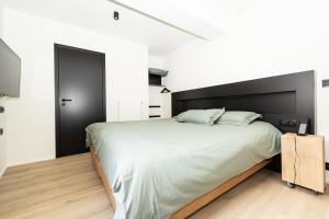 Un ou plusieurs lits dans un hébergement de l'établissement Hôtel de la Poste