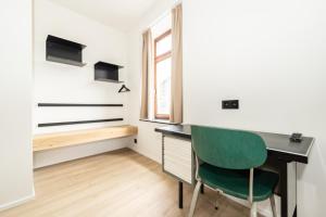 Télévision ou salle de divertissement dans l'établissement Hôtel de la Poste