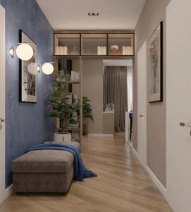 een slaapkamer met een bed en een blauwe muur bij MEGA Almaty ATRIA in Alma-Ata