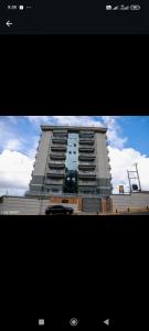 a picture of a tall apartment building at Luqman Apartments in Meru
