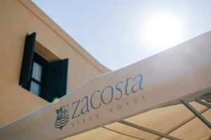 Um certificado, prêmio, placa ou outro documento exibido em Zacosta Villa Hotel