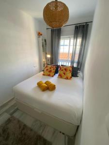 En eller flere senge i et værelse på Village delight