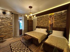 Postel nebo postele na pokoji v ubytování Vila Eden Boutique Hotel