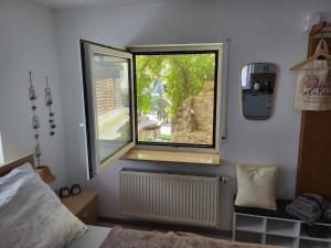 Postel nebo postele na pokoji v ubytování Eulennest Nassau