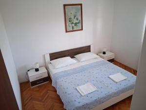 Voodi või voodid majutusasutuse Apartments Božito toas