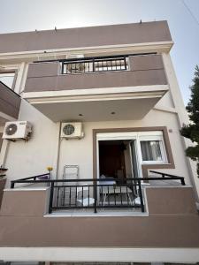 a balcony of a house with a table and chairs at Gerapetros 82 in Ierapetra
