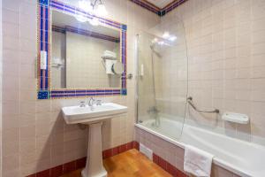 a bathroom with a sink and a shower and a tub at Moon Dreams El Cortijo in Matalascañas