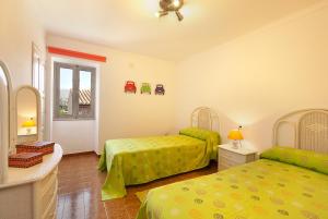 a bedroom with two beds and a window at Gruat 31 - Vallem Properties in Pollença