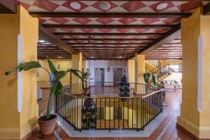 a hallway of a building with a staircase and a ceiling at Moon Dreams El Cortijo in Matalascañas