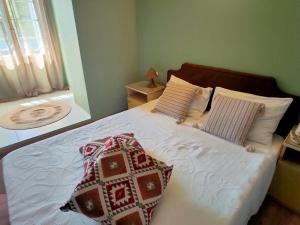Postel nebo postele na pokoji v ubytování Galini Hotel Agios Ioannis Pelion