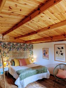 a bedroom with a bed and a wooden ceiling at Gaviota Beach Chiclana in Chiclana de la Frontera +85 photos