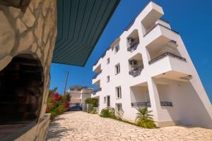a view of a building from the street at Villa Butrint in Ksamil