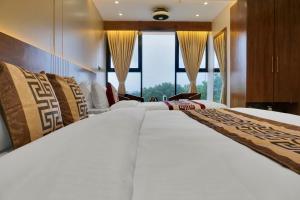 Postel nebo postele na pokoji v ubytování Hotel Sayba International