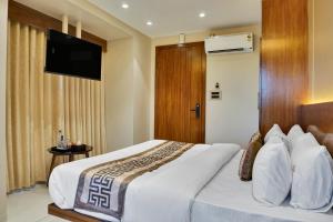 Postel nebo postele na pokoji v ubytování Hotel Sayba International