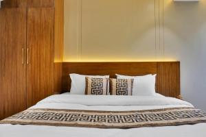 Postel nebo postele na pokoji v ubytování Hotel Sayba International