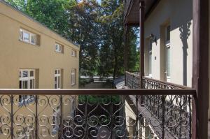 an empty balcony of a house with a gate at Habitat Apartments in Kraków