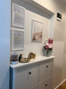 a bathroom with a sink and a counter at Elegant seaside stay - Vitolu street apartment in Liepāja +34 photos