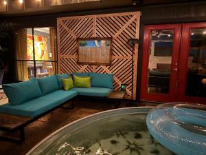 a living room with a couch and a table at Artful Abode in Beaumont