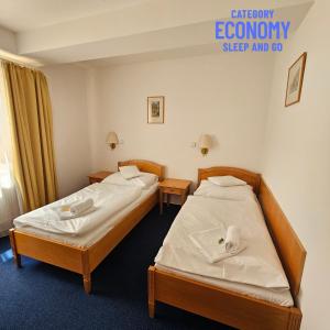 Posteľ alebo postele v izbe v ubytovaní Hotel Claris