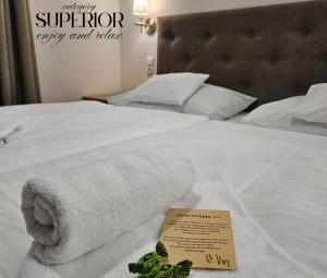 Posteľ alebo postele v izbe v ubytovaní Hotel Claris