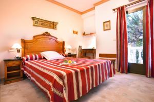 Postel nebo postele na pokoji v ubytování Hotel Rosa
