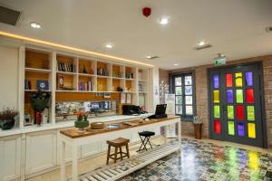 a room with a desk with a laptop on it at Cunda Fora Hotel in Ayvalık